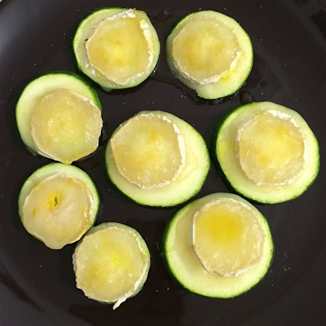 Grilled sliced zucchini and sliced goat cheese, with a bit of olive oil and honey over it. Easy a...