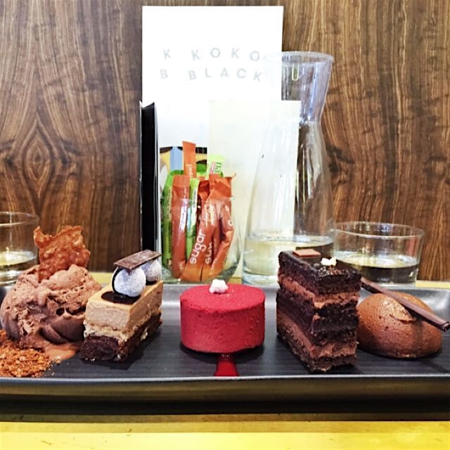 Chocolate ice cream, chocolate hazelnut clusters, raspberry mousse, chocolate alchemy cake, belgi...