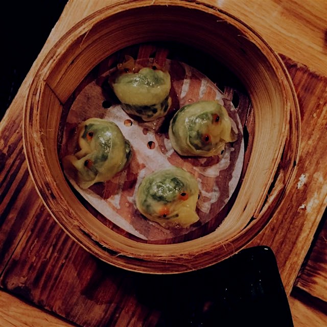 Bamboo steamer with shrimp and snow pea dumplings. Also these dumplings have eyes 👀👀👀