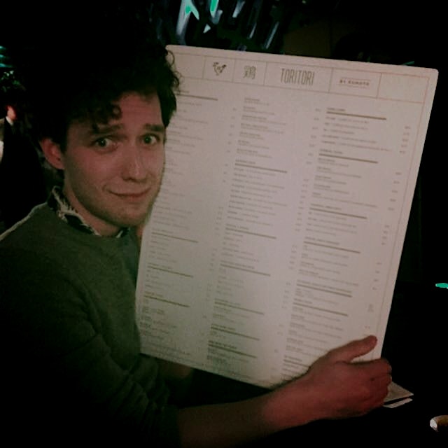 Brock looking slightly overwhelmed by the world's largest menu