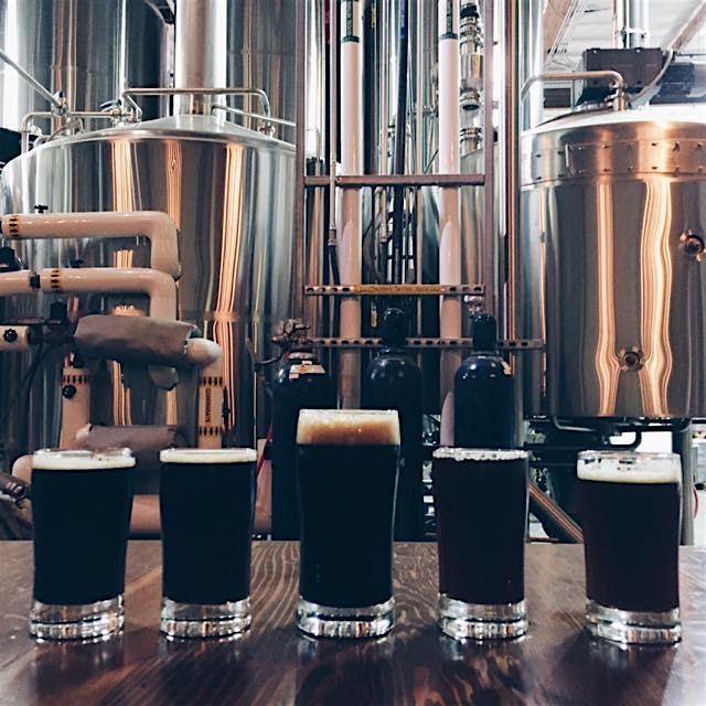 An epic beer tasting. The imperial stout (dead center) takes the cake. 