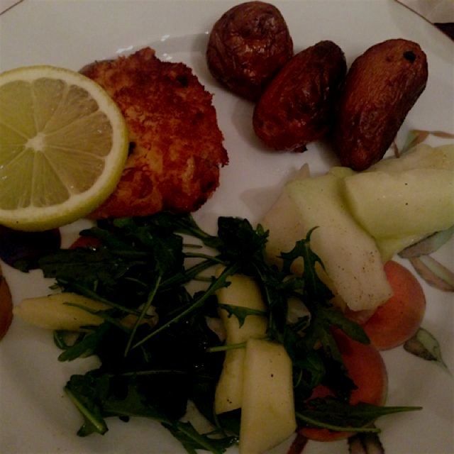 Random NYE plate: crab cakes with paprika and tarragon, kohlrabi +olive oil and lemon, arugula an...