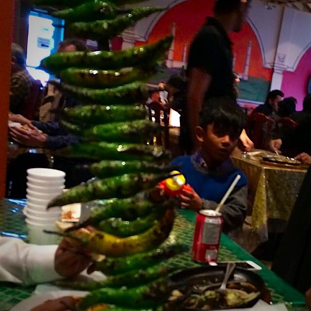 Talk about adding spice! These are grilled green chile peppers roasted in the tandoor.. About 800...