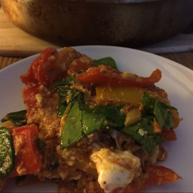Turkish menemen with spinach, peppers, and cheese