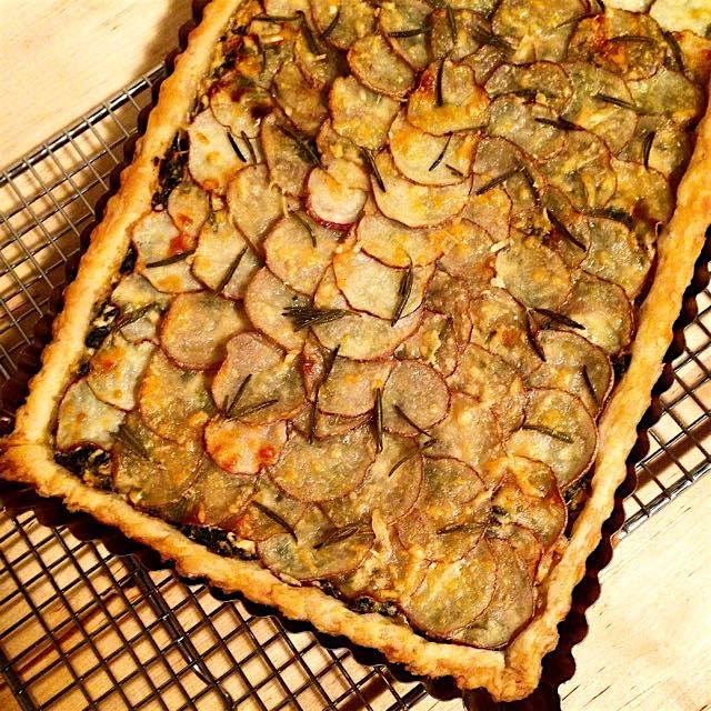 Potato, Kale and Rosemary Tart. Ricotta with sauted onions and kale topped with thinly sliced pot...