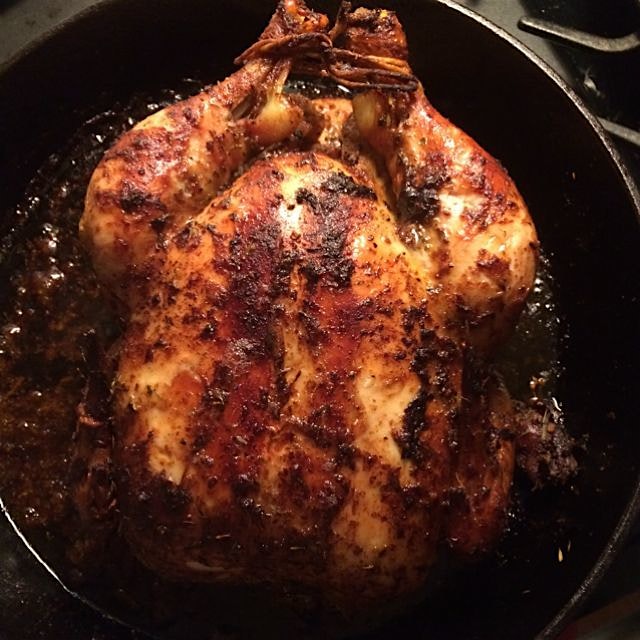 Mustard, fresh herbs and lemon marinade inside,caribbean jerk and lemon outside -happily cooking ...