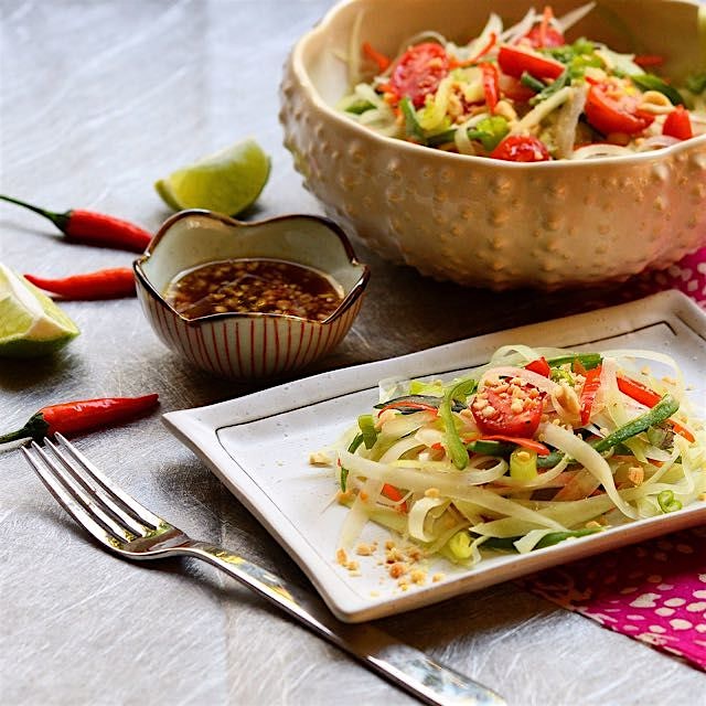 Thai green papaya salad with an intensely sweet and tangy dressing with a little kick of heat. 