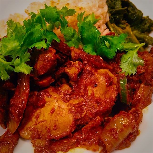 Spicy curried chicken livers w brown rice & sautéed mustard greens. 