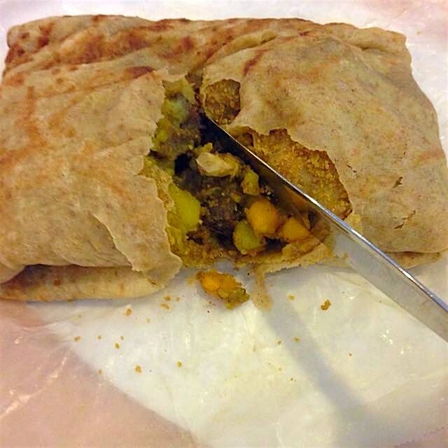 The perks of a carribbean neighborhood: delicious lunch options. See "doubles," hot roti with yel...