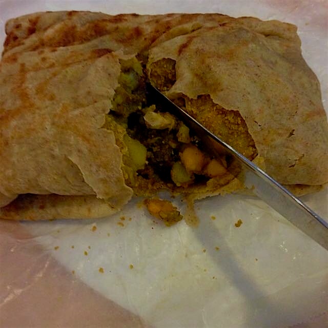 The perks of a carribbean neighborhood: delicious lunch options. See "doubles," hot roti with yel...