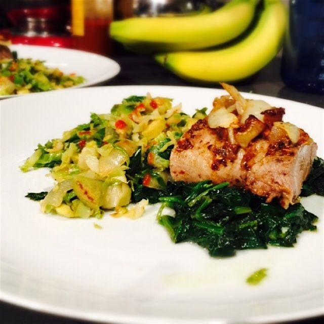 Sunday supper with pork tenderloin from @flyingpigsfarm on a bed of spinach with sriracha brussel...