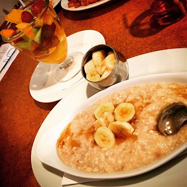 Oatmeal, Bananas, & Maple Syrup w/a side of Fruit Salad. Hard to find good clean food in the area...