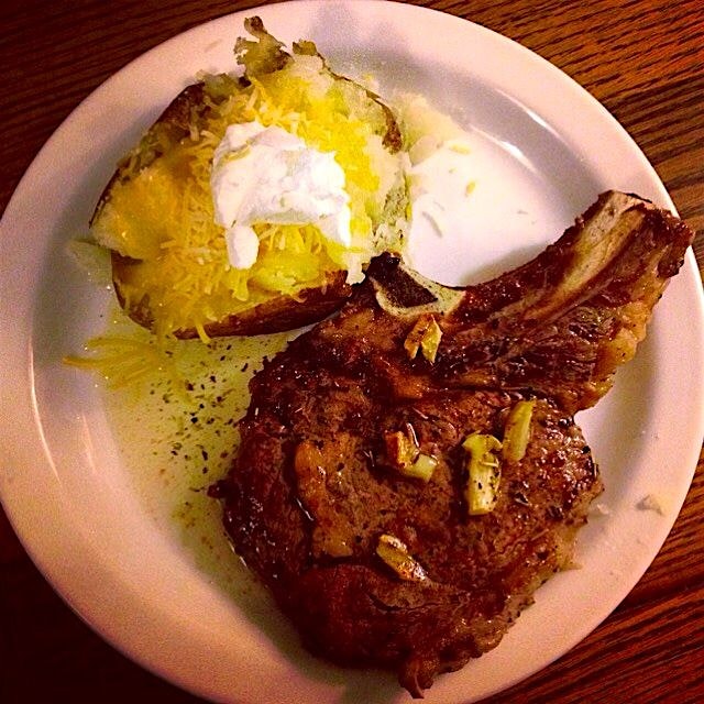 Bone-in Rib-eye steak basted with garlic herbed butter. 