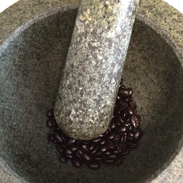 Hand-grinding Migongo Farms Rwandan Coffee