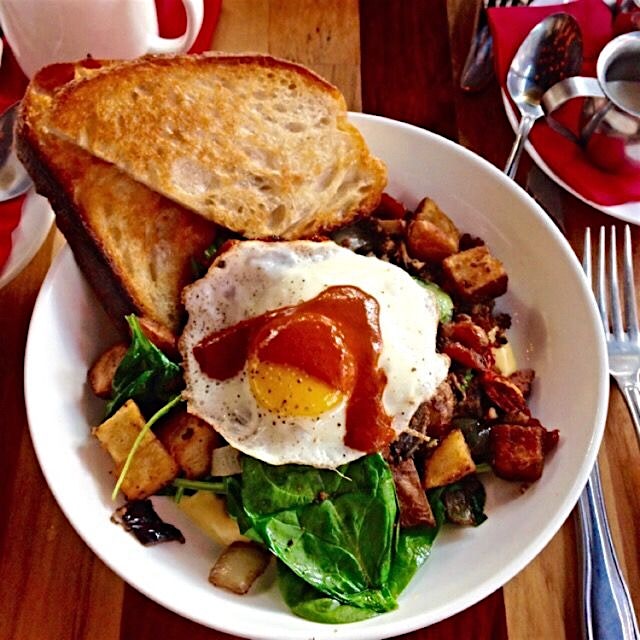 Great brunch at Von's 1000 Spirits Gustobistro, Seattle.  Perfectly runny egg over a spicy sausag...