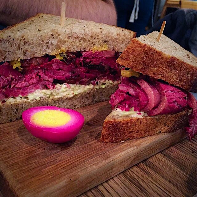 Pastrami on rye, both prepared in-house, served with a beet-cured egg. Yum!