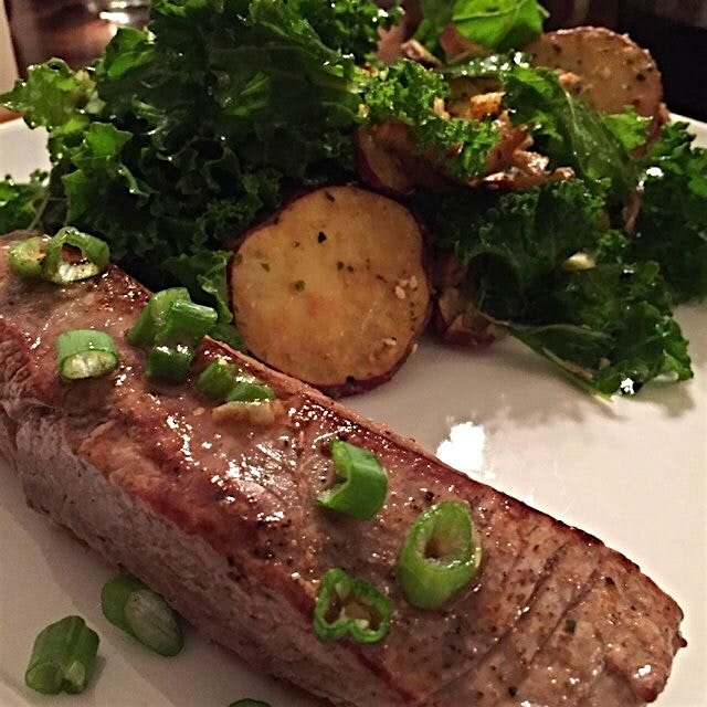 Flank steak and kale salad with roasted Japanese sweet potatoes, purple top turnips, scallions, m...