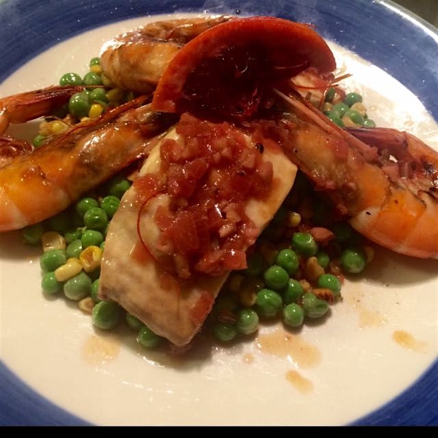 Fresh shrimp & mahi over pea & corn succotash drizzled with a blood orange reduction. A @MichaelH...