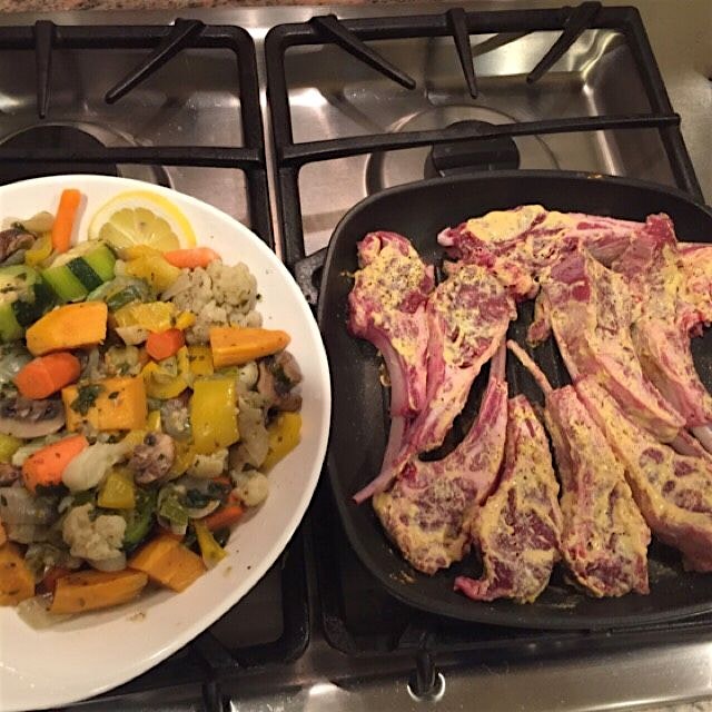 Lamb chops prepped with English mustard .  Soon and once cooked will join the vegetables on the d...
