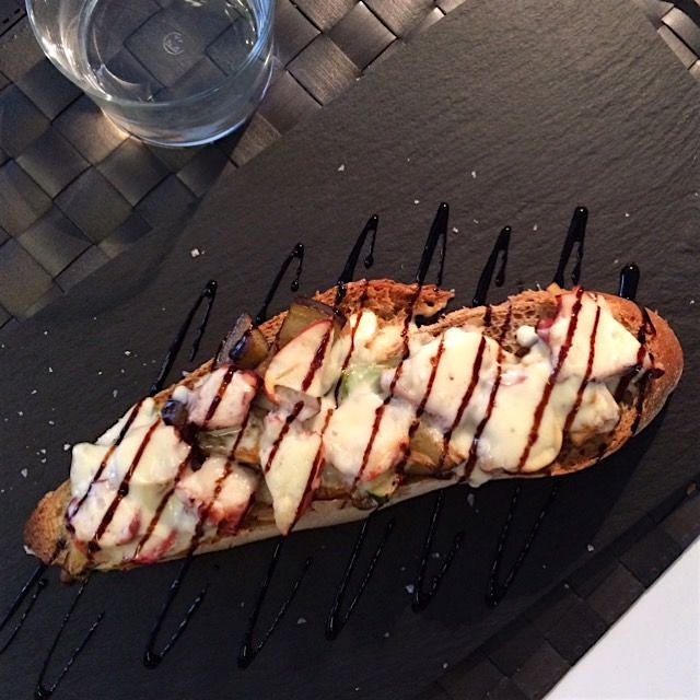 Delicious toast with octopus, vegetables and Tetilla cheese. This is a kind of Galician cheese. L...