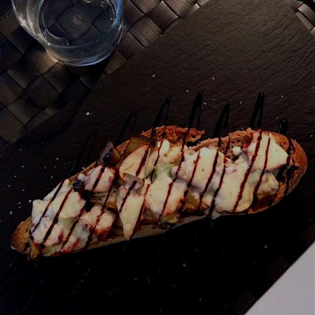 Delicious toast with octopus, vegetables and Tetilla cheese. This is a kind of Galician cheese. L...