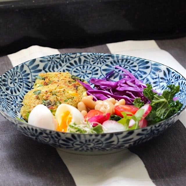 Quinoa, spinach and feta cheese patties served with greens, beans and soft-boiled egg