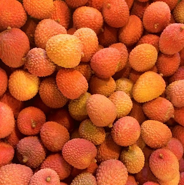 Shopping for veggies, distracted by lychees. 
