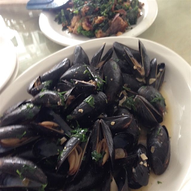 Mussels with broccoli rabe, fried potatoes and bacon. 