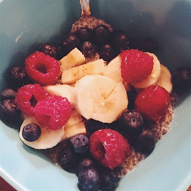 Chia seed almond milk "pudding" topped with fresh fruit and a drizzle of honey 