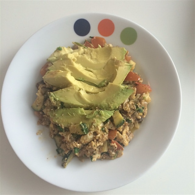 Loaded scrambled eggs topped with avocado 