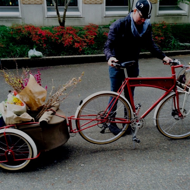 The chef from Ned Ludd with his restaurant bike seen at the farmers market.