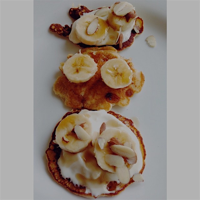 Toasted coconut pancakes (mix from Trader Joes) with Greek yogurt, maple syrup, and slivered almo...
