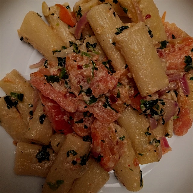 Easy pasta with tomatoes, basil, parsley, pine nut, and ricotta.