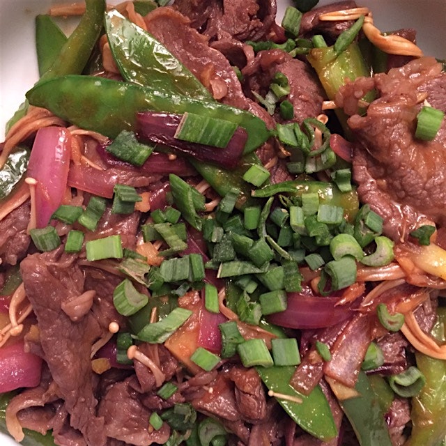 Bulgogi beef stir fry with snow peas, green pepper, red and green onion, and lots of ginger.