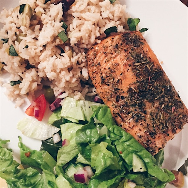 Mediterranean baked salmon with brown basmati rice and salad - herbs and olives everywhere!