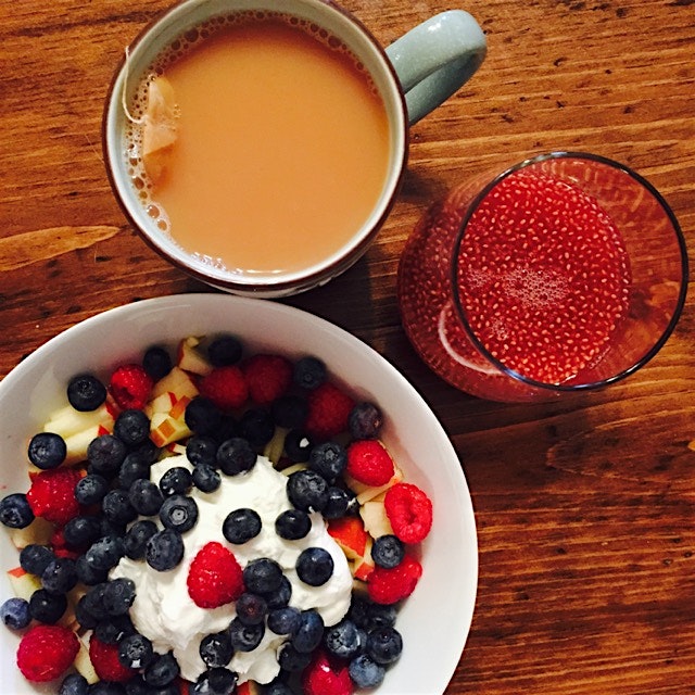 Breakfast is served: Greek yogurt with apple and berries, raspberry kombucha with chia seeds and ...