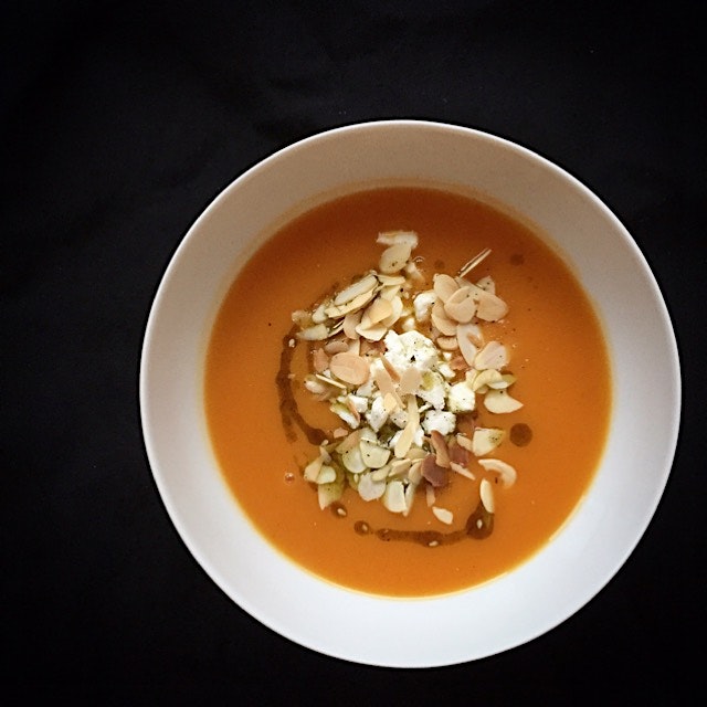 Sweet potato soup topped with Za'atar infused oil, feta cheese and toasted almonds