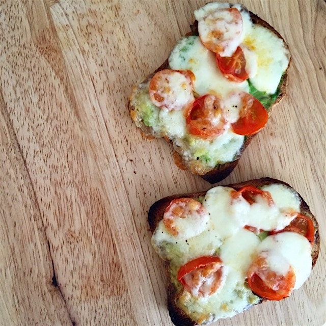 Grilled cheese avocado toasts topped with cherry tomato and mozzarella! One of my favorite breakf...