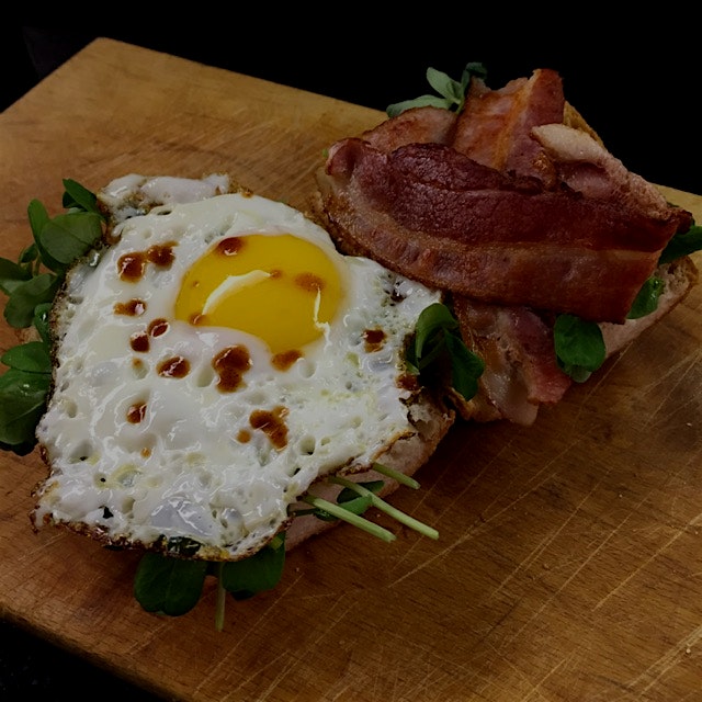 Decadent weekend breakie. Double smoked bacon, the perfect sunny side up egg, pea shoots and hot ...