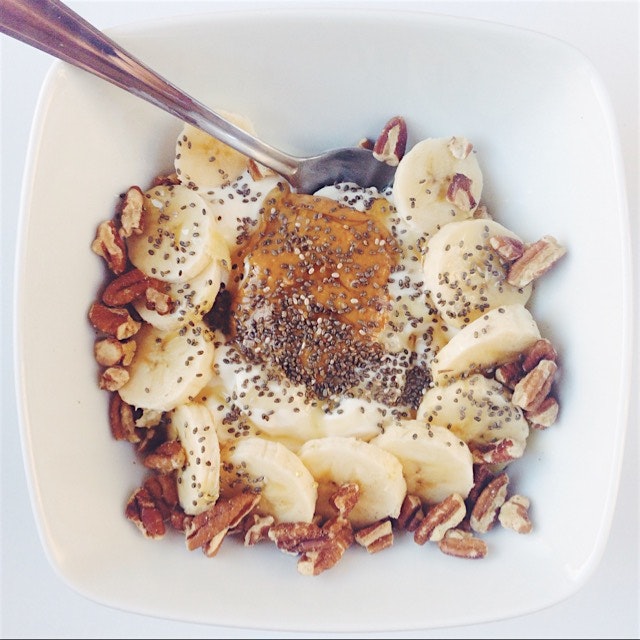 Breakfast: Greek yogurt, bananas, pecans, chia seeds, and a drizzle of honey! Oh, and a dollop of...