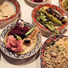 Lunch of the Greek gods. Taramasalata, tapenade, hummus, grilled pitas, feta stuffed spicy peppers, and lemon rice. I could eat this every day 😊