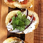Goat cheese bruschetta with red onion, garlic, diced tomatoes, and fresh mint.