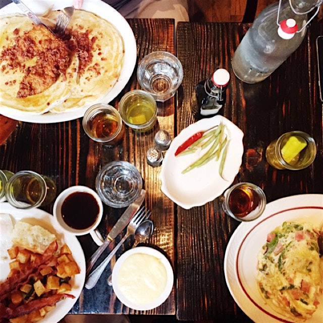 Birthday brunch complete with pancakes, fried chicken, eggs, sausage, bacon, grits, whiskey and p...