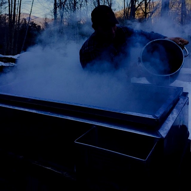Boiling the maple sap into syrup