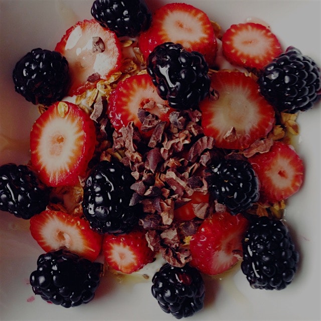 Breakfast bowl! Greek yogurt, berries, homemade granola, cacao nibs, and a drizzle of honey :) 