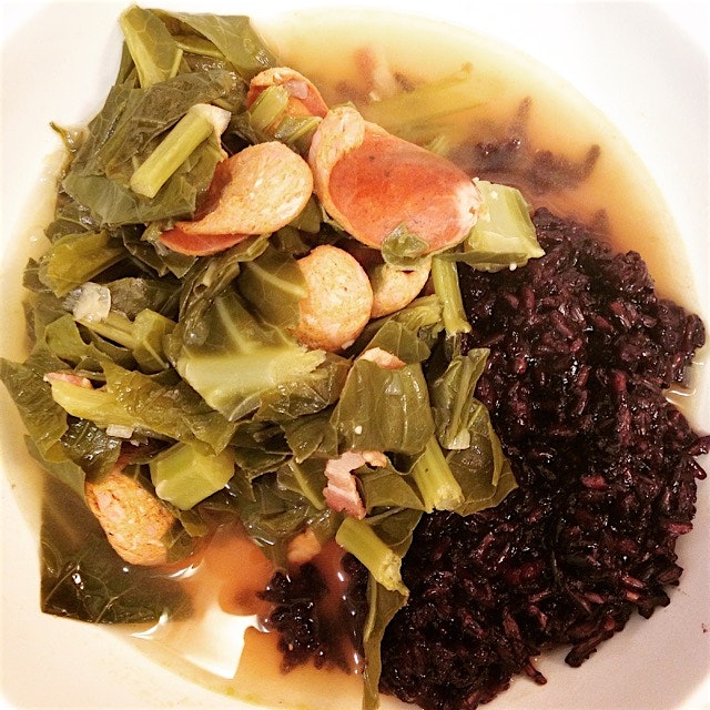 Greens with smoked andouille and a bit of bacon over black rice. 
