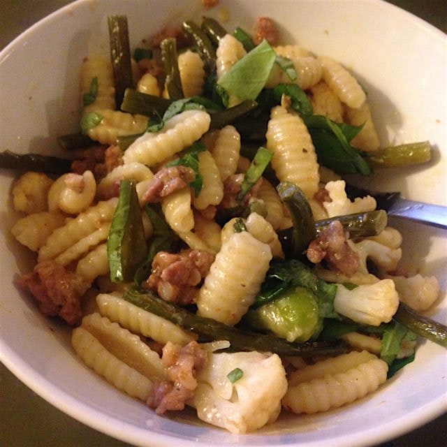 Starting out the weekend right. All local cavatelli with sausage, cauliflower, garlic scapes, fav...
