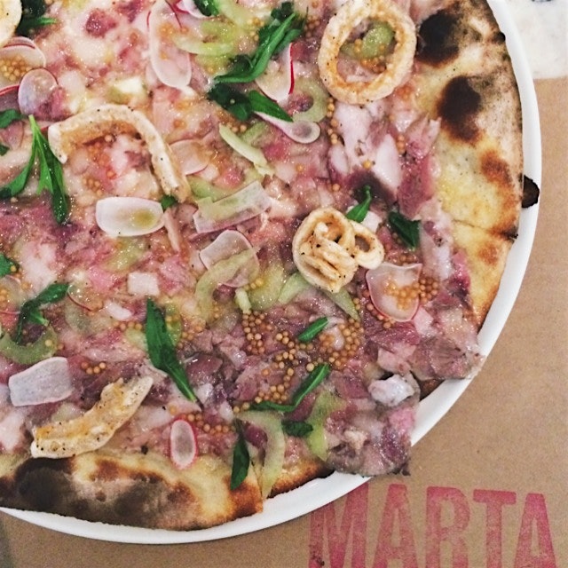 Testa pizza - pig face, fontina, celery, radish, pickled mustard seeds, and cracklings