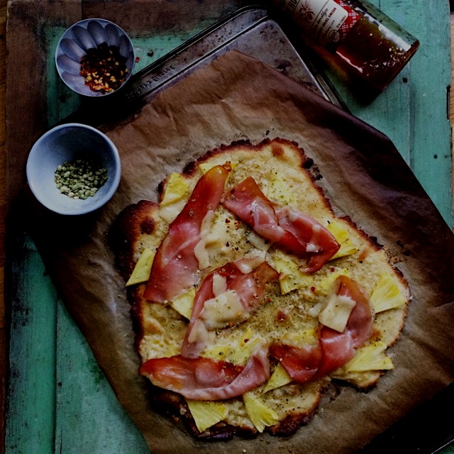 An homemade glutenfree pizza with the classic ham (speck from local store) and pineapple toppings...