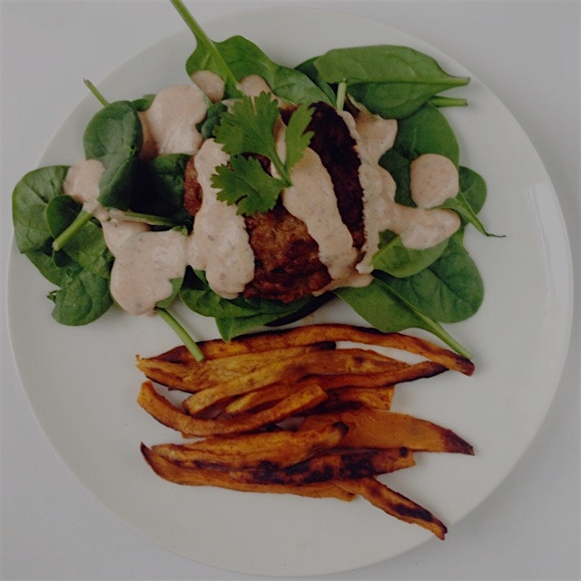 Keeping it clean for dinner tonight. Homemade turkey burger on spinach with a spicy chipotle yogu...
